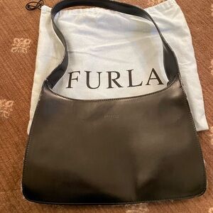 Furla black leather handbag.